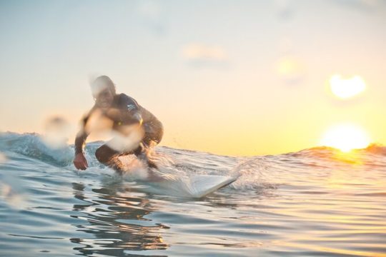 Learn to surf on the endless beaches in southern Fuerteventura
